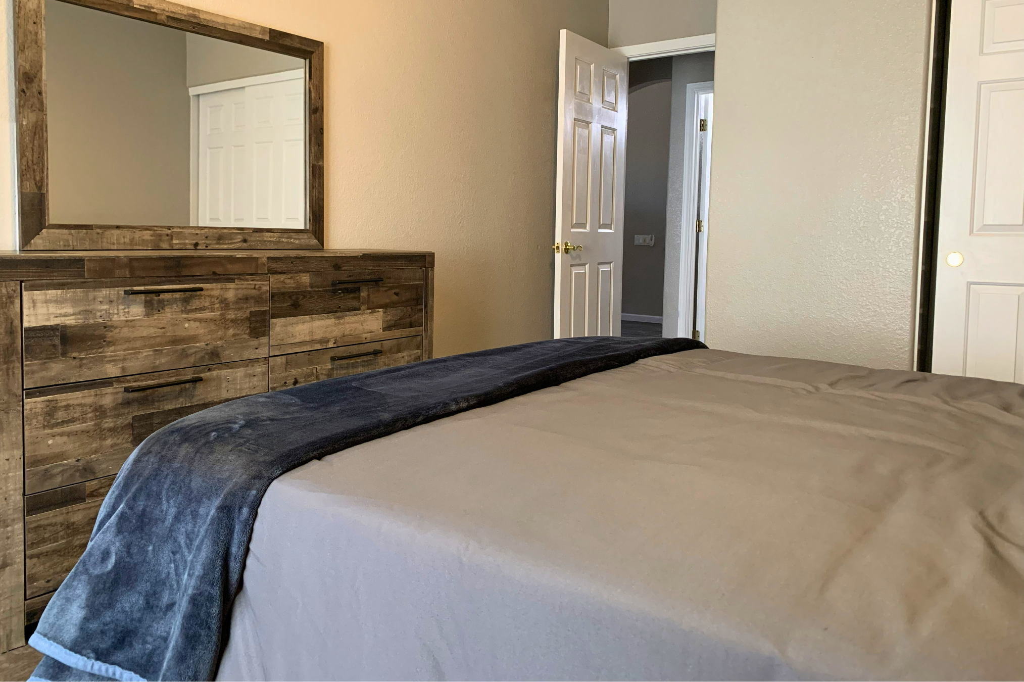 Bedroom #2: Large dresser and closet space for easy unpacking and an organized stay. 