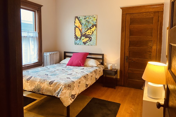 Cozy queen bed in Butterfly Room