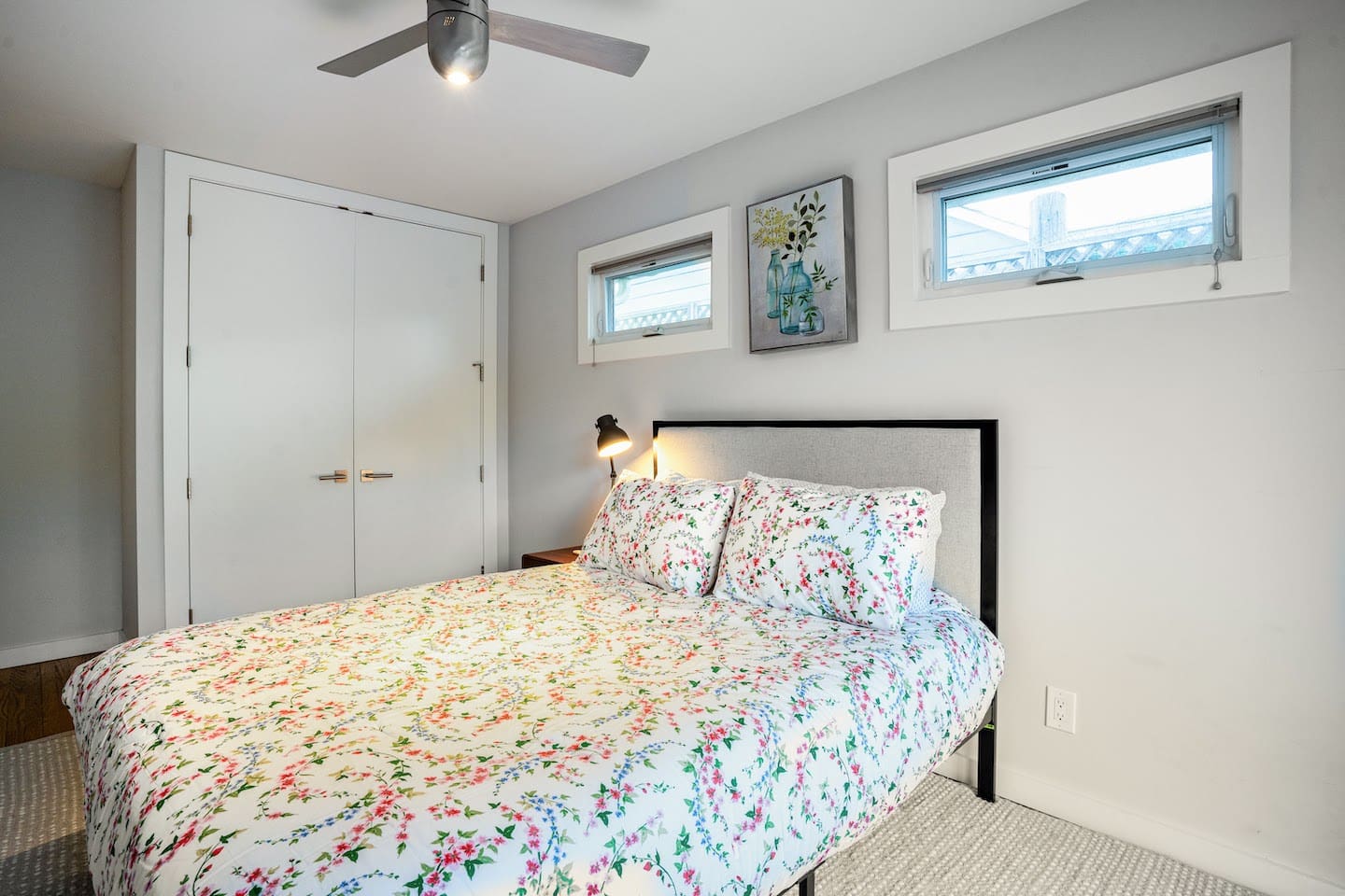 Bedroom 2 with queen bed and with access to backyard and pool.