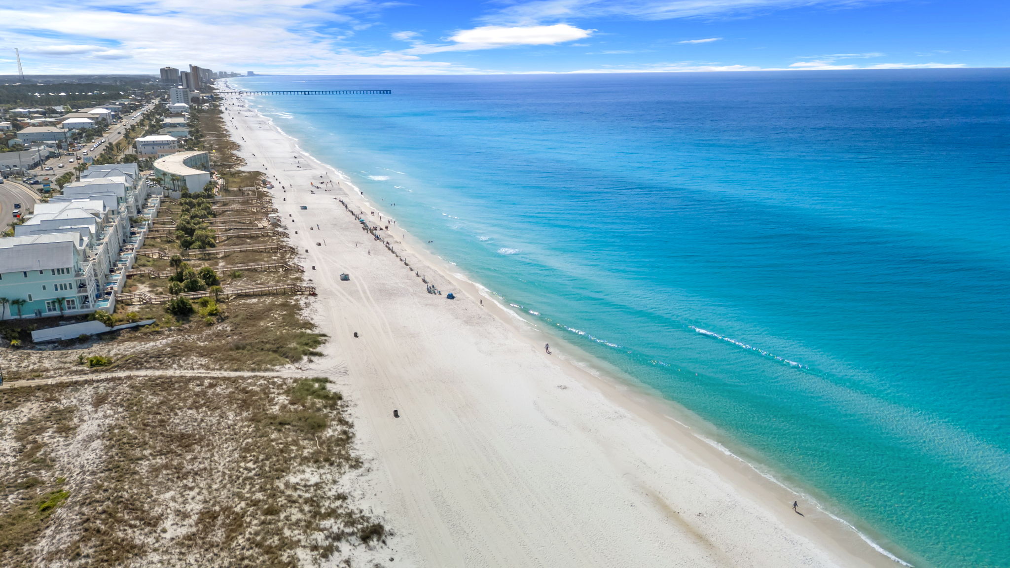 The Bid-A-Wee private beach stretches wide with turquoise water and white sand.  Your exclusive beach access means no hunting for a public spot.
