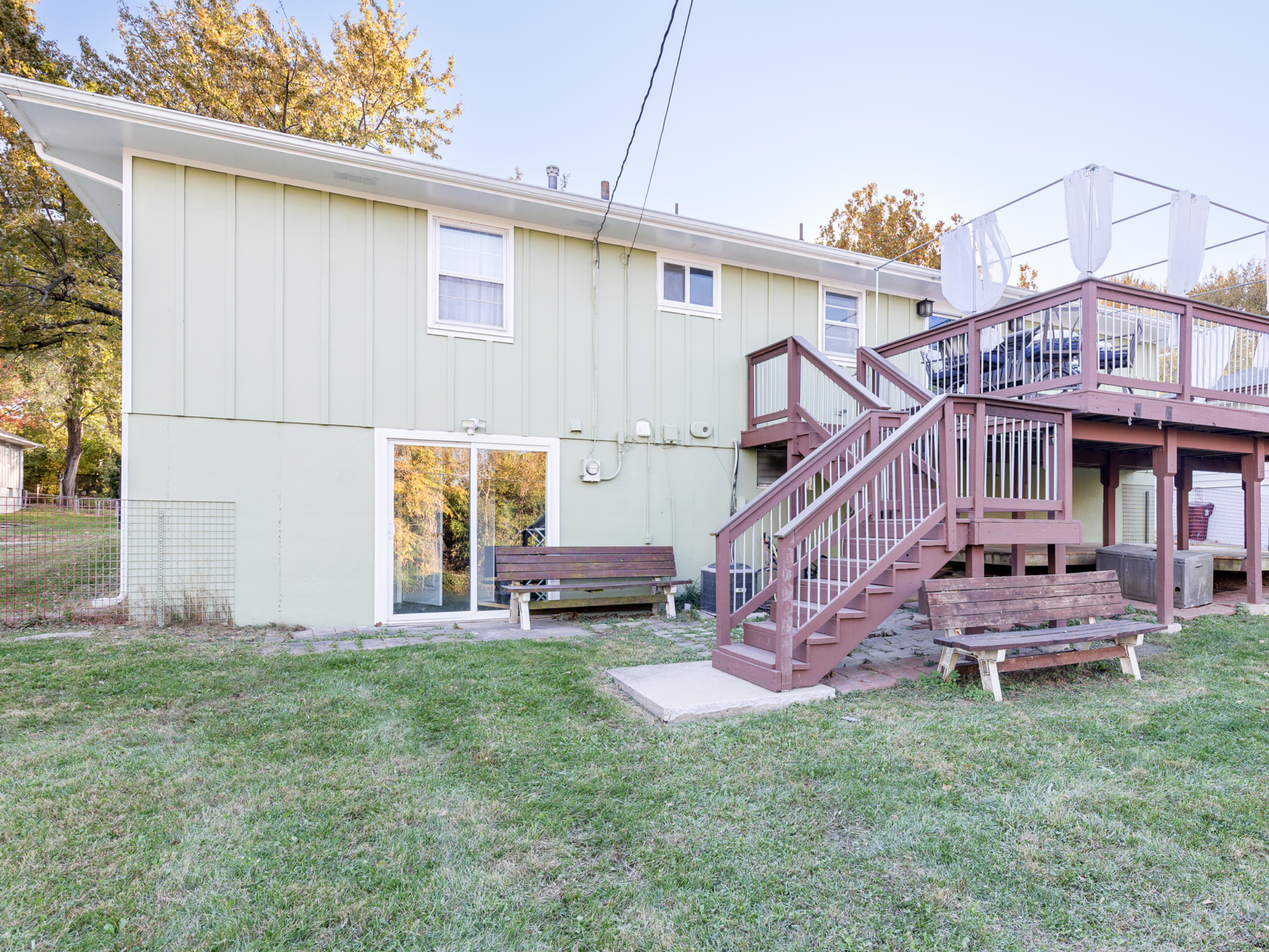 Rear exterior of the home with direct access to the yard and outdoor areas.