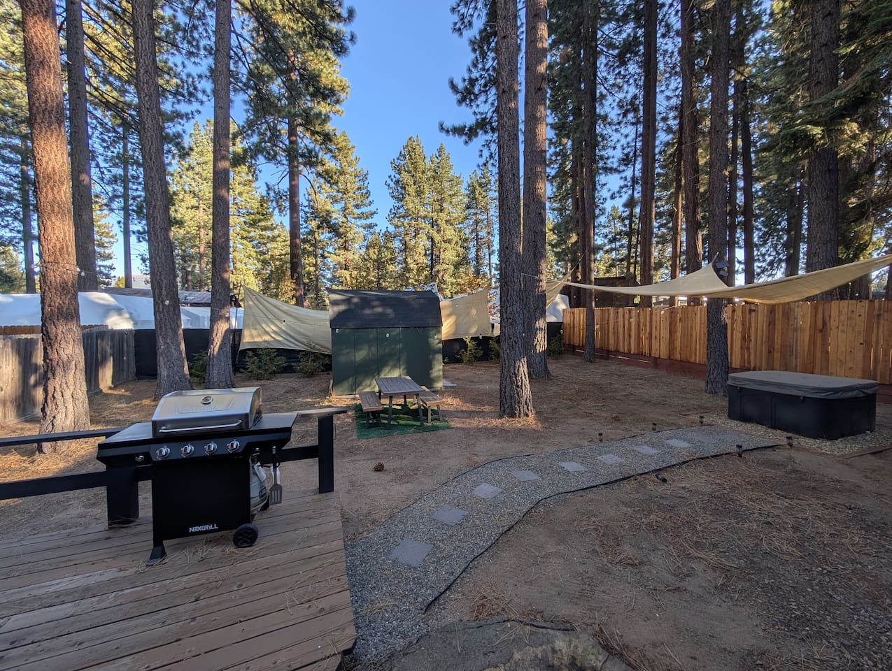 The ultimate mountain getaway awaits in this spacious, pine-sheltered backyard. Fire up the gas grill for an outdoor dinner on the deck, then wind down under the stars in your private hot tub.
