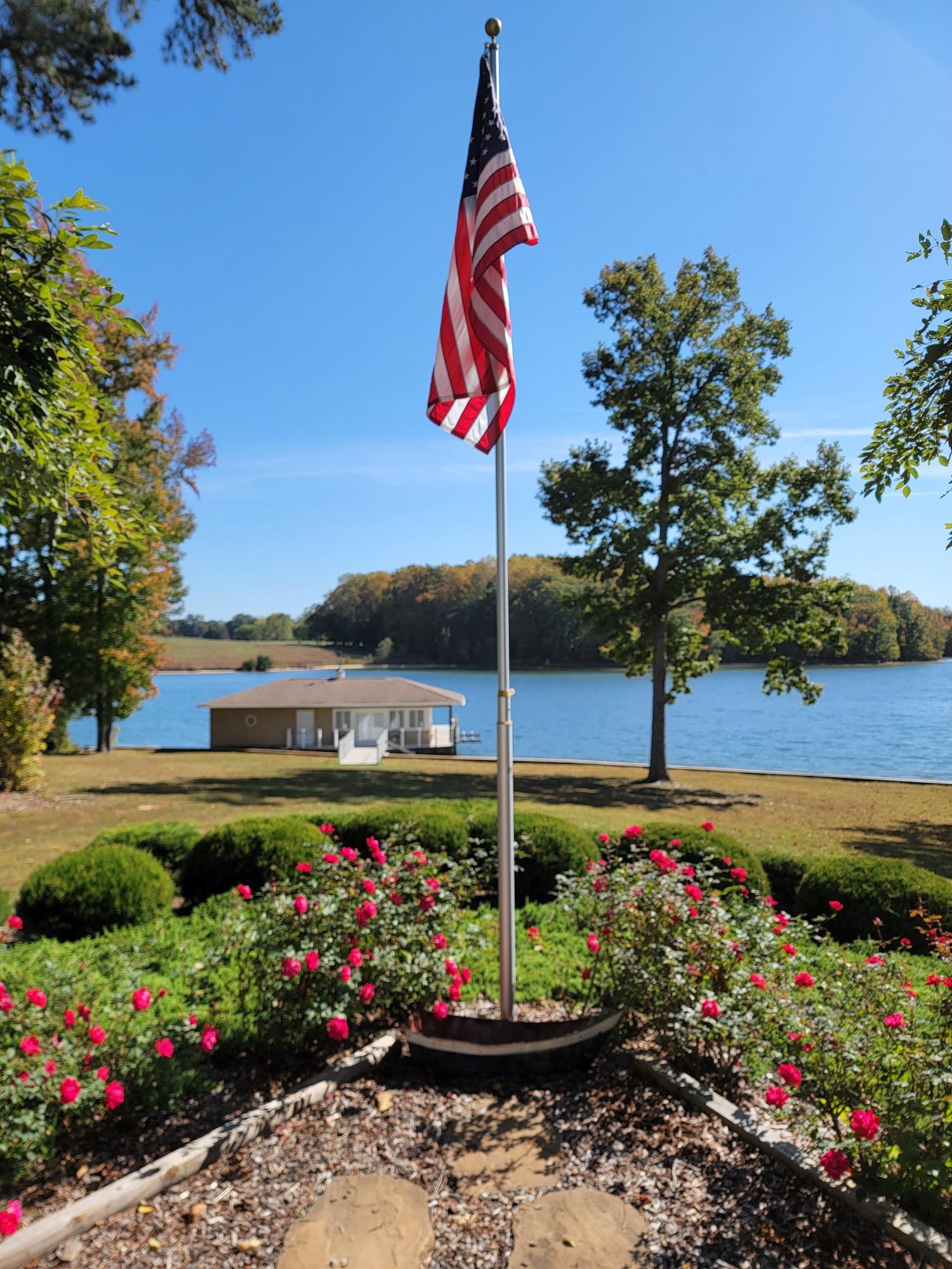 Beautiful rose bushes line the patio, adding a touch of color and charm to your lakefront stay.