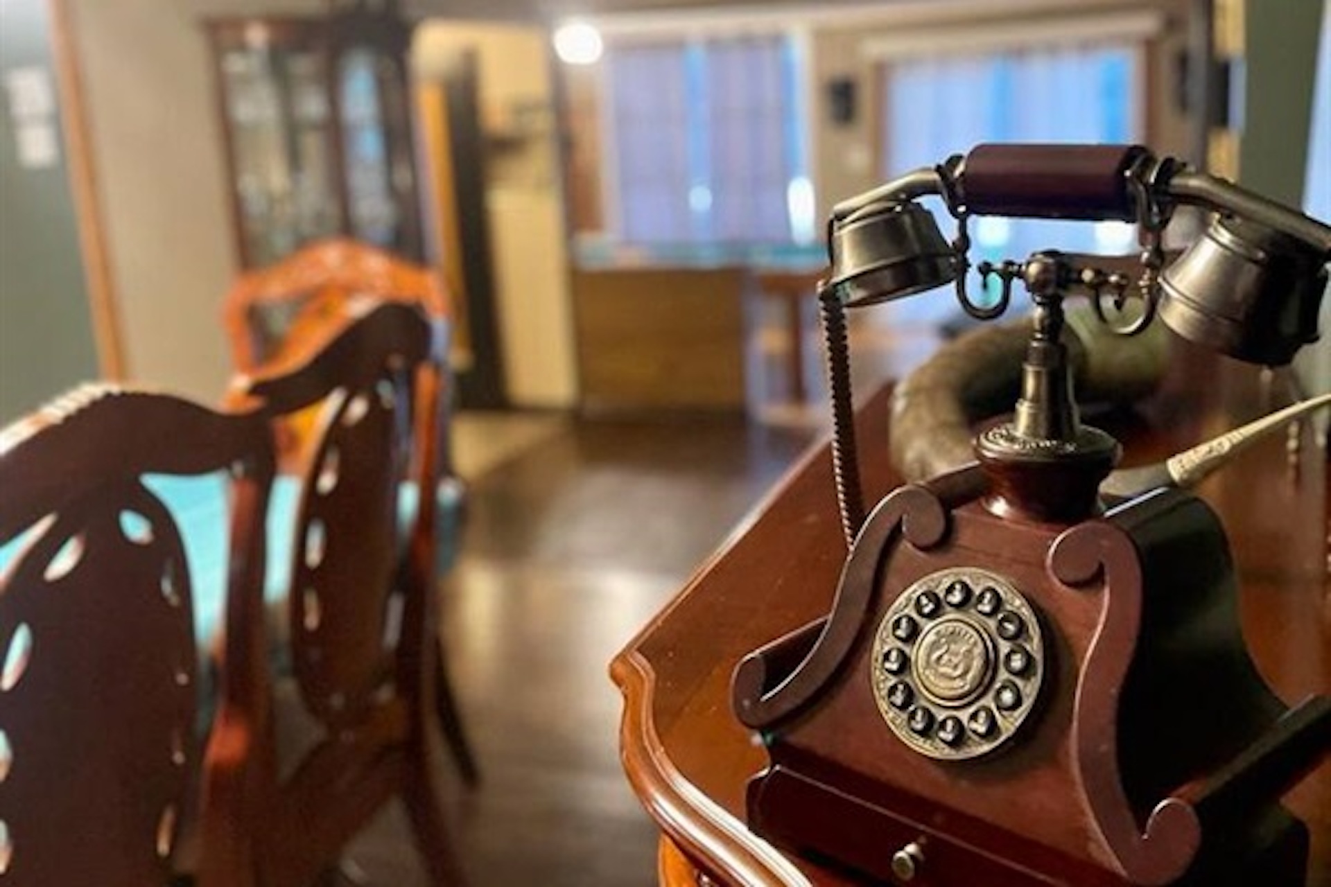 Dining area with vintage-style telephone and warm interior details
