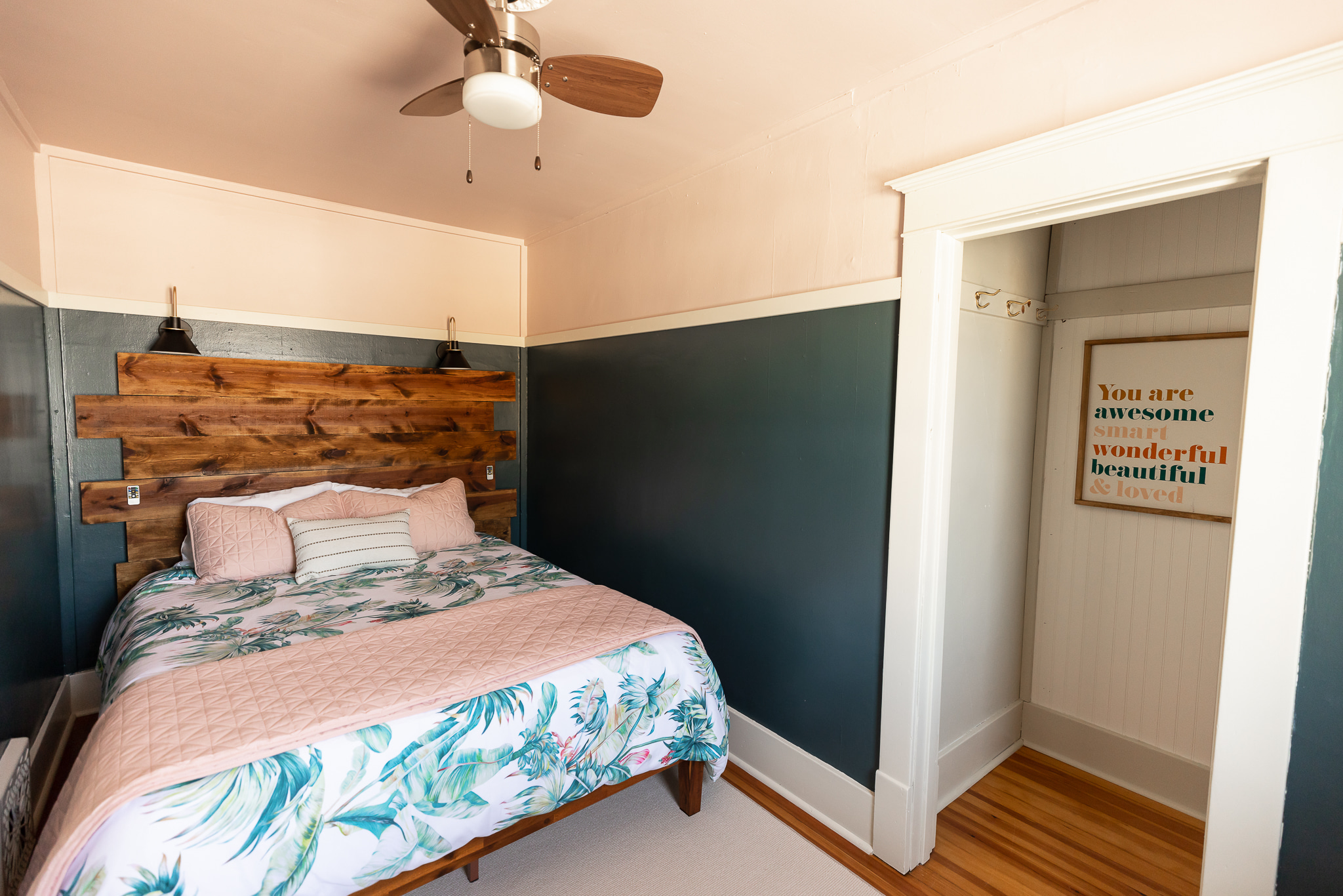 The front bedroom is a tight squeeze, but a comfortable queen awaits you with plenty of storage in the open closet.