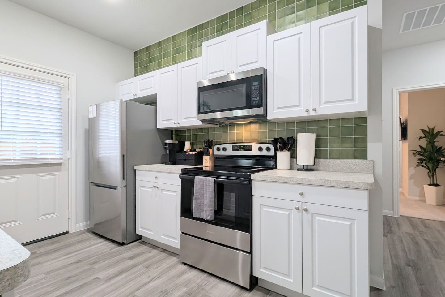 Large galley kitchen is fully stocked for all your cooking needs. 