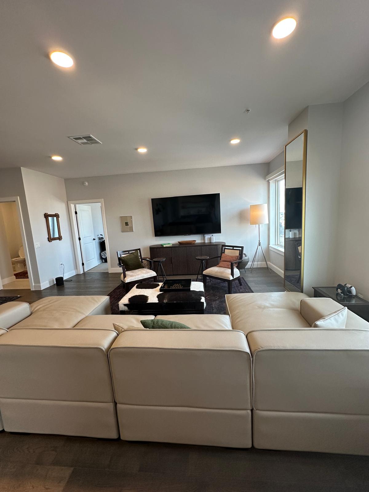 Giant Sectional Couch and 85 inch Television