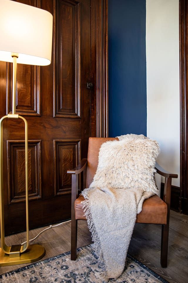Cozy living room chair, perfect for lounging or reading, adding both comfort and style to the space.