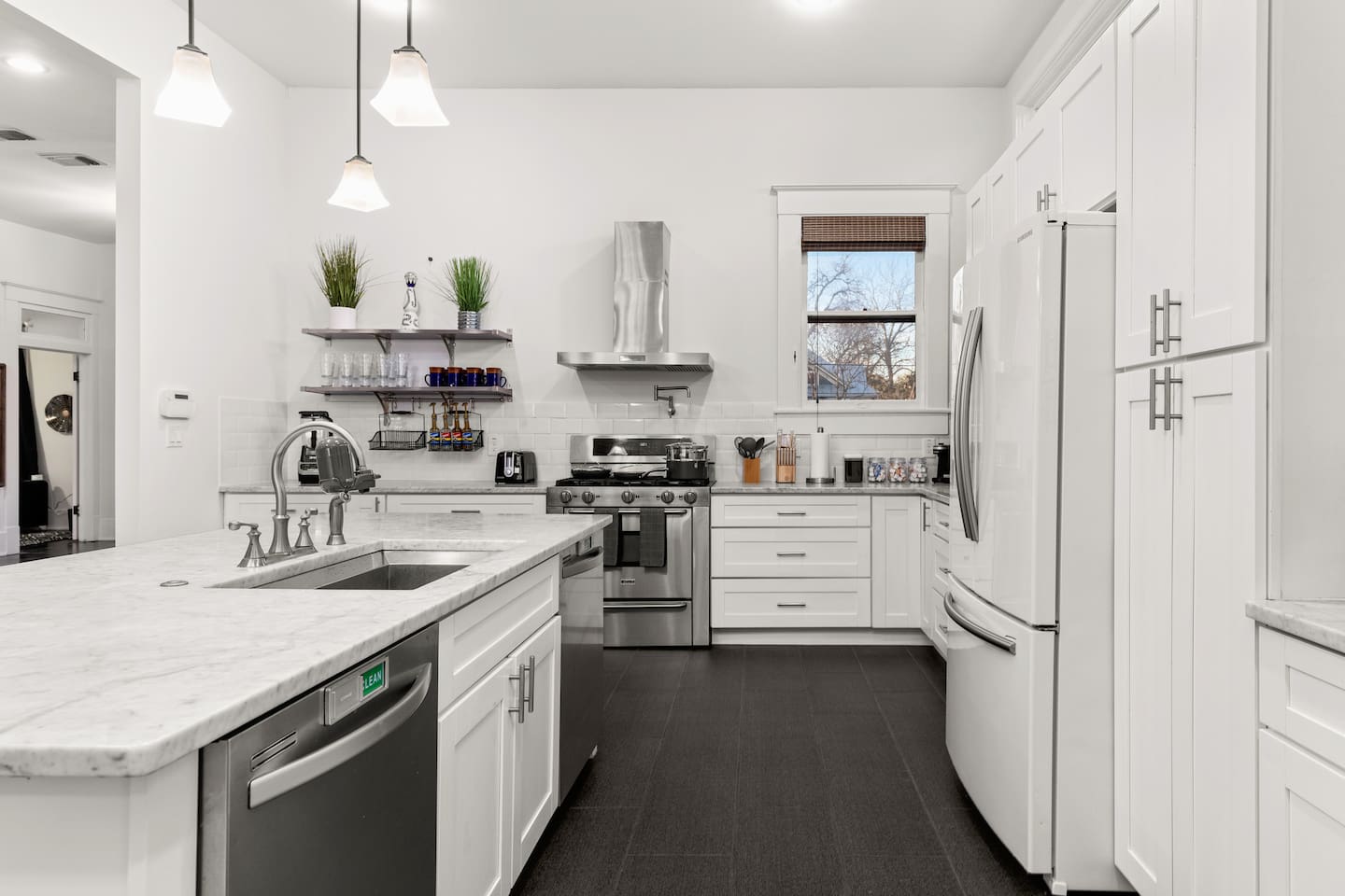 Savor the modern elegance of our bright and airy kitchen, where every appliance and amenity beckons you to cook with joy.
