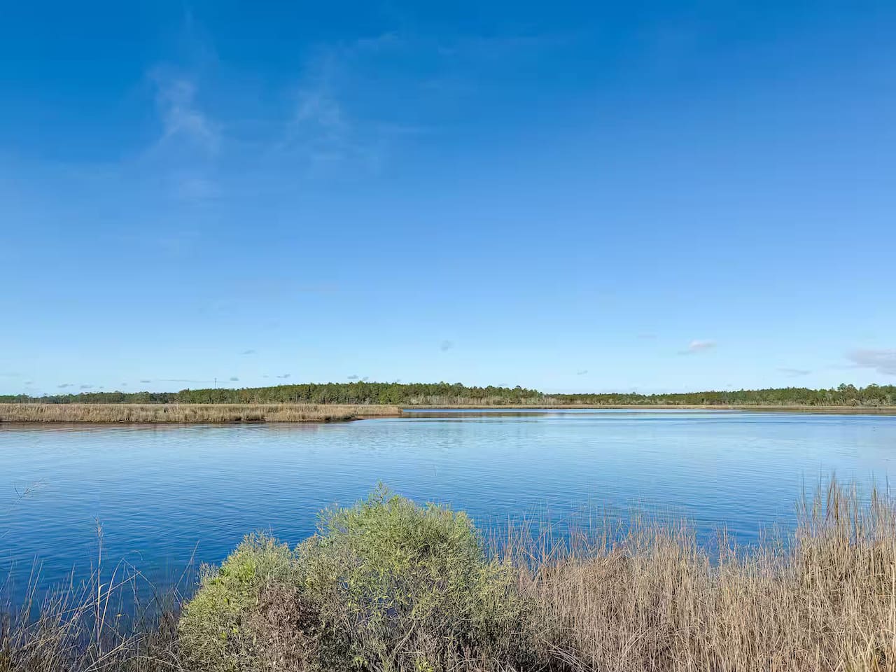 Tranquil waterfront views with calm waters and open skies—perfect for relaxing and soaking in the coastal scenery.
