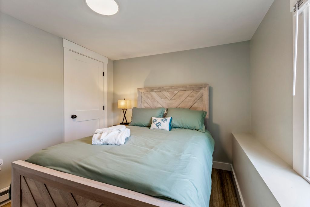 Master bedroom with a comfortable queen-size bed.