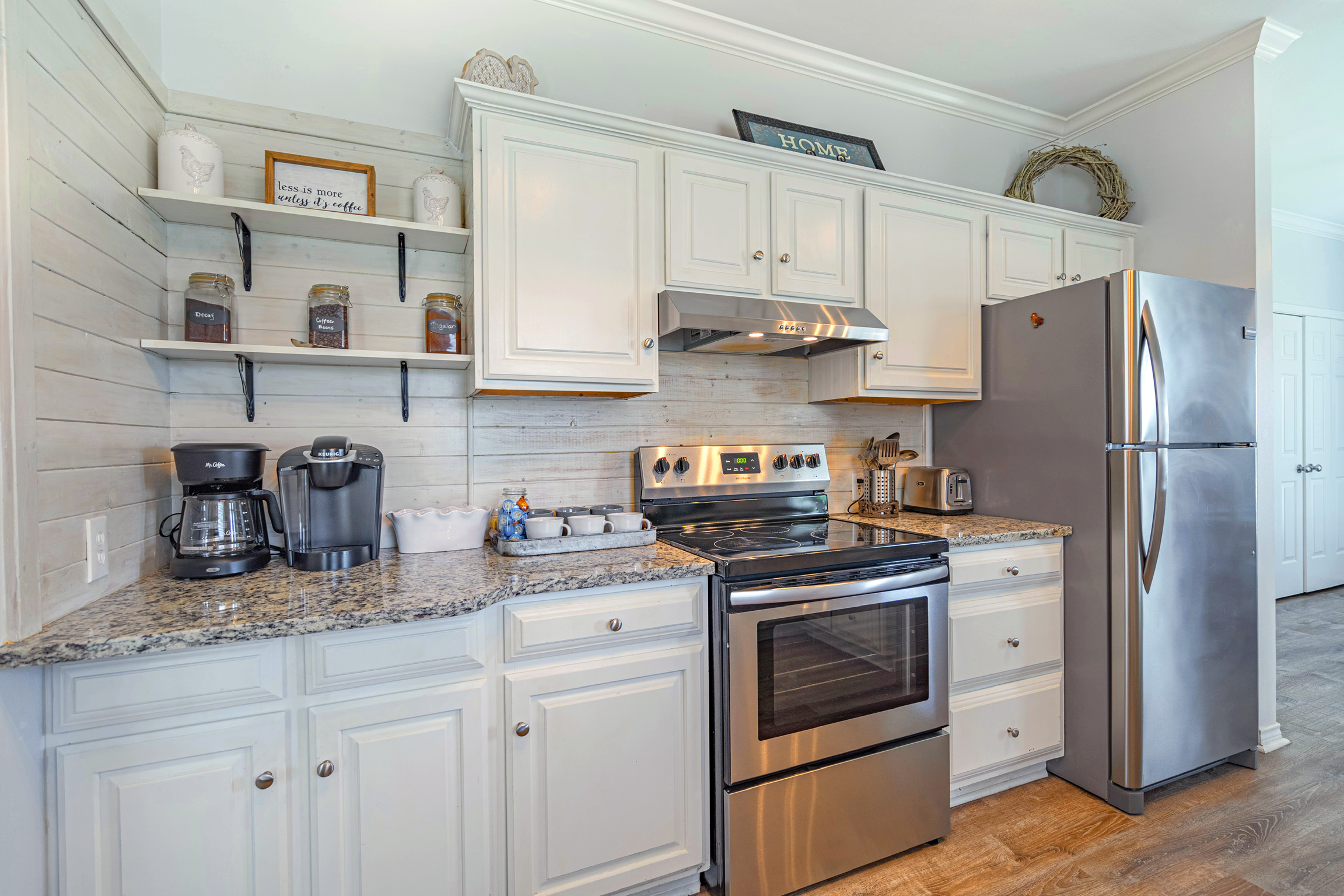 Farmhouse kitchen - stocked with dishes, utensils, and basic cookware