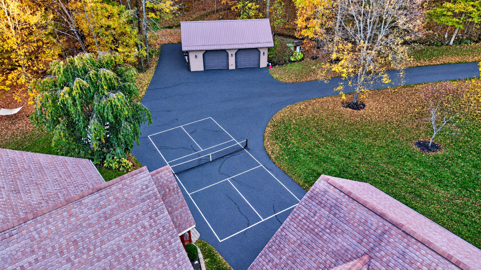 Tennis court and detached garage from above