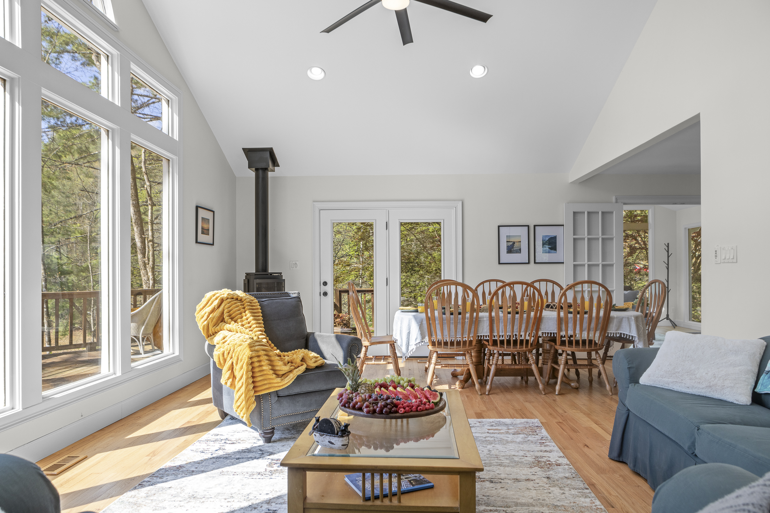 Living Area: Sun-drenched retreat with inviting furnishings and delightful forest views!