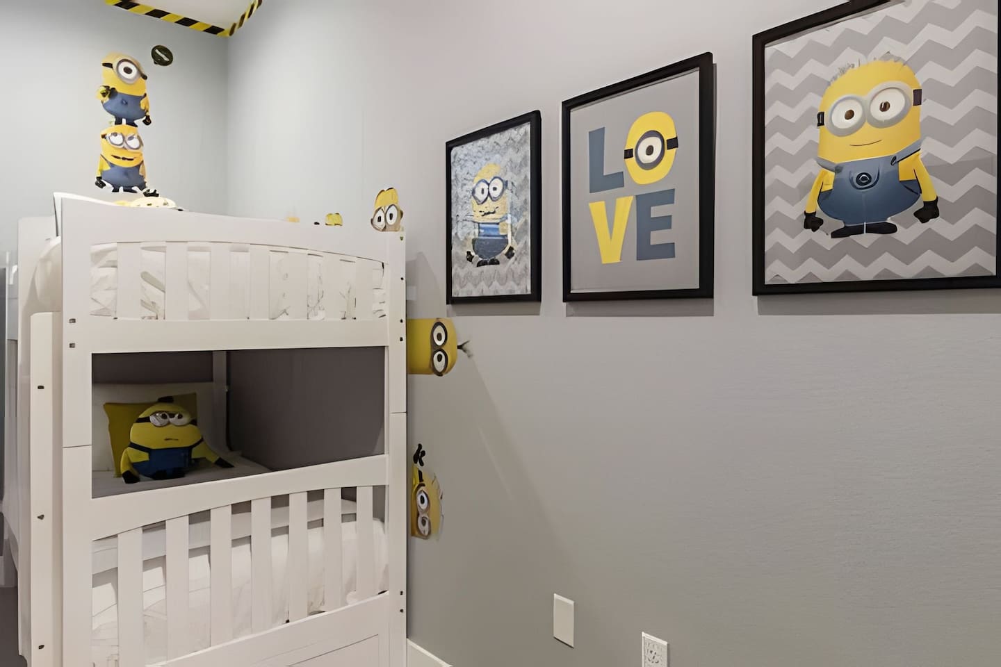 Kids will love this playful Minions-themed room with bunk beds, a Smart TV, and fun décor.