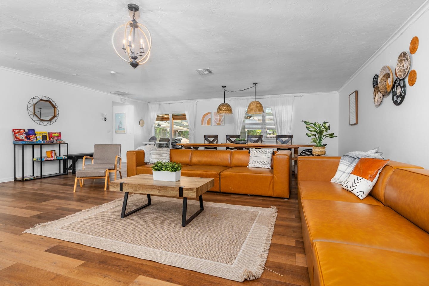 Newly decorated! Huge boho themed living room with 12-foot long custom dining table.