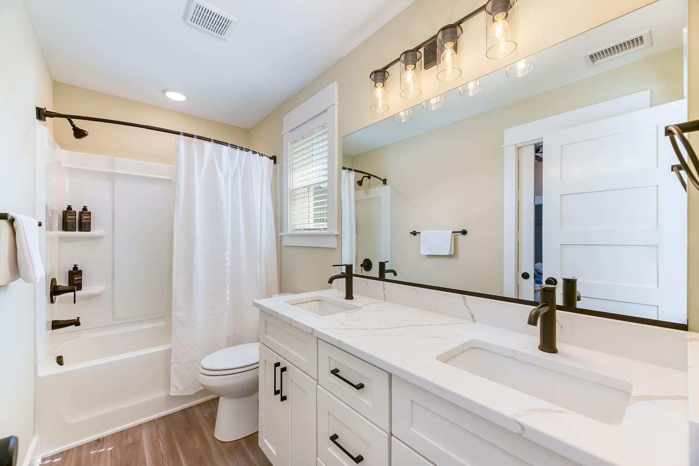 Convenient full bathroom connecting the king and queen guest bedrooms.