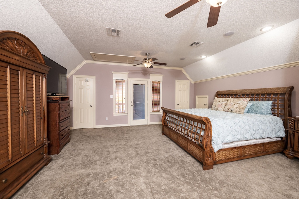 primary bedroom with king bed, en suite bathroom, private balcony and desk