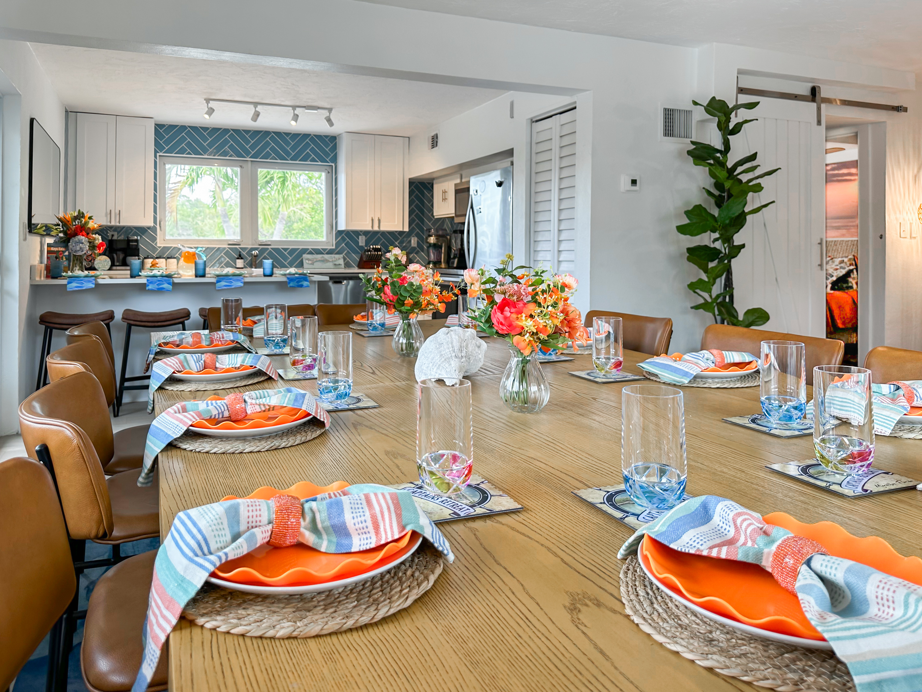 The large dining table seats 12 people with 2 on each end.