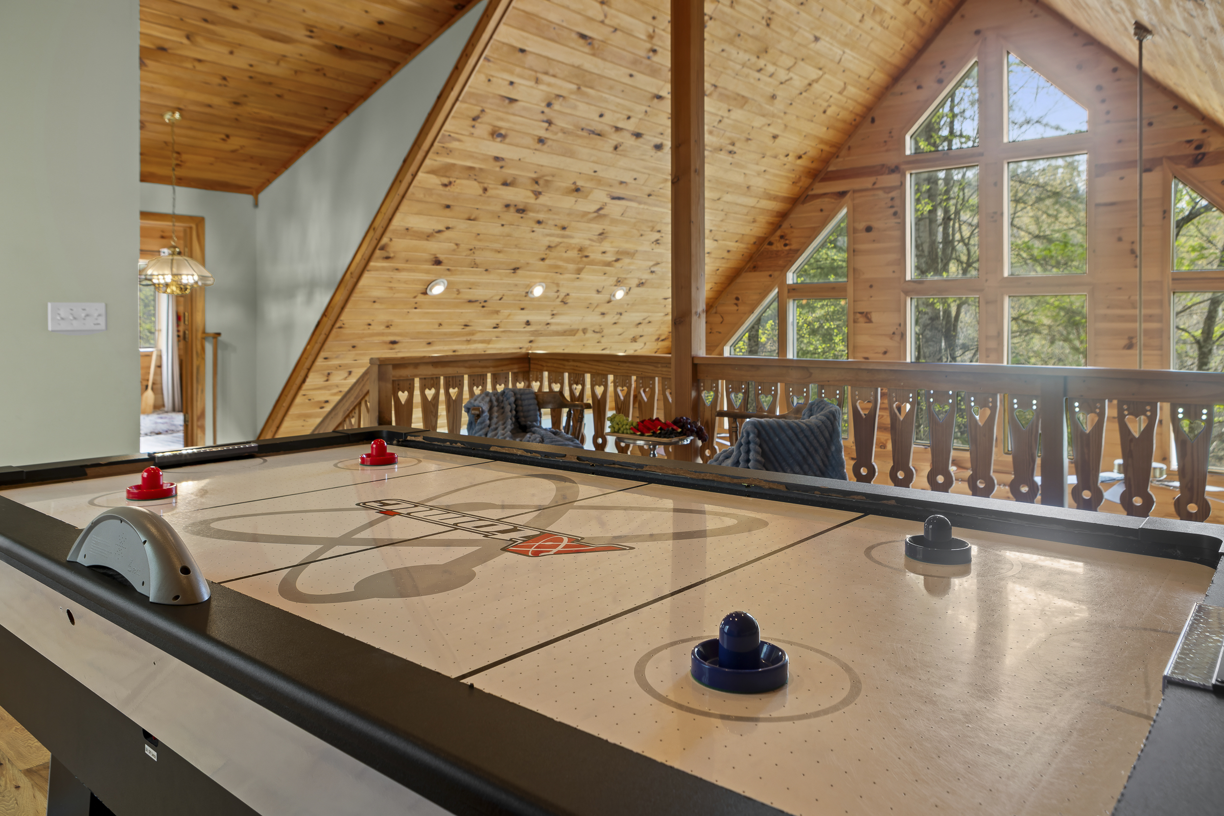 Game Area: Challenge friends to air hockey in this spacious, sunlit retreat with stunning views!