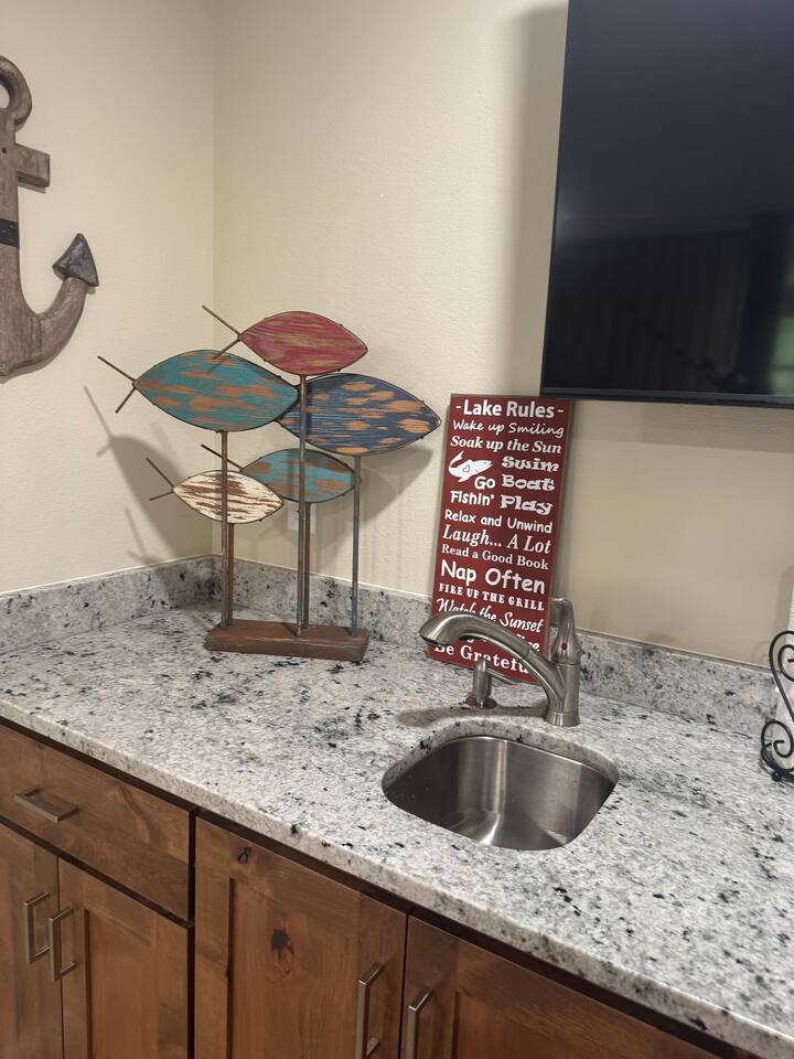 Lower level Bar Sink above Beverage Fridge