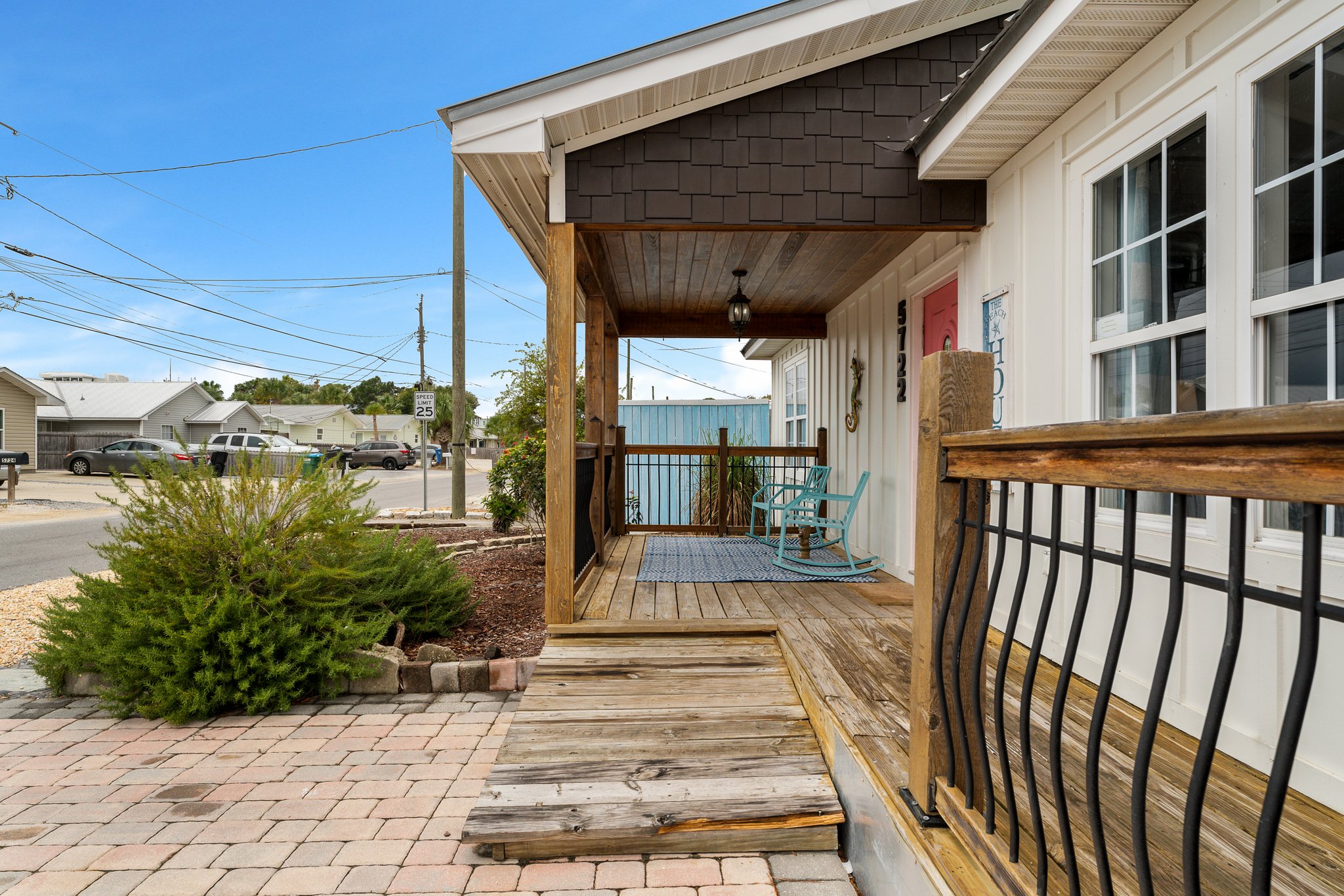 Covered hot tub, dartboard, sunroom interior
