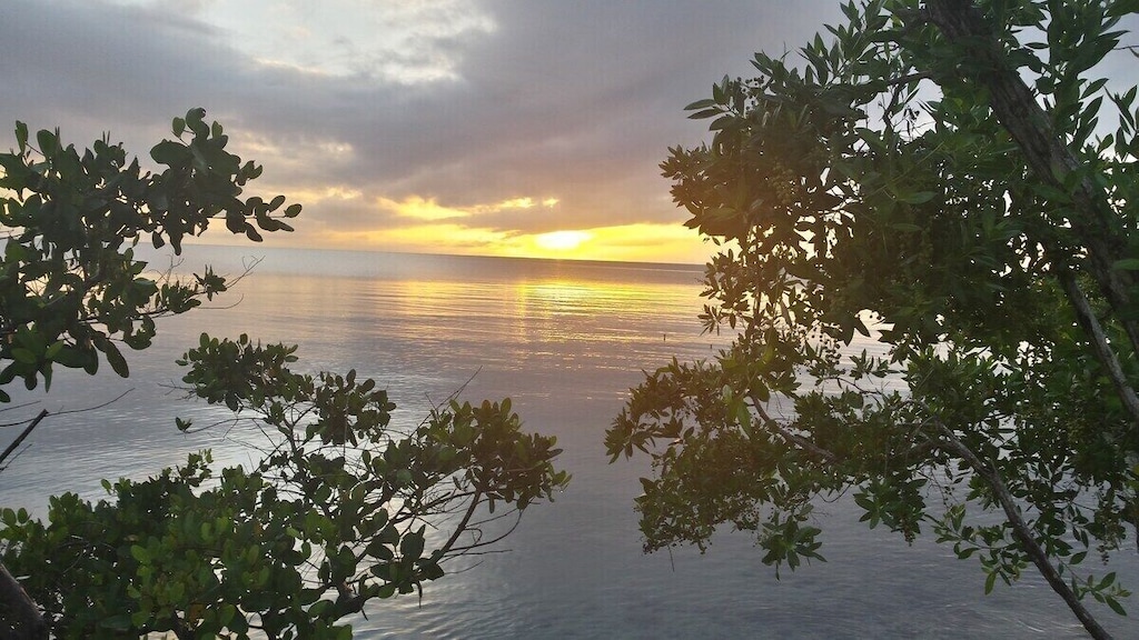 Sunset from the palapa (a rooftop deck with a thatched covered sun shade)