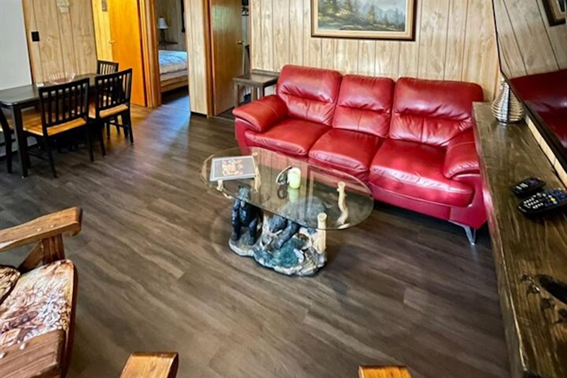 Living room with red sofa and central coffee table