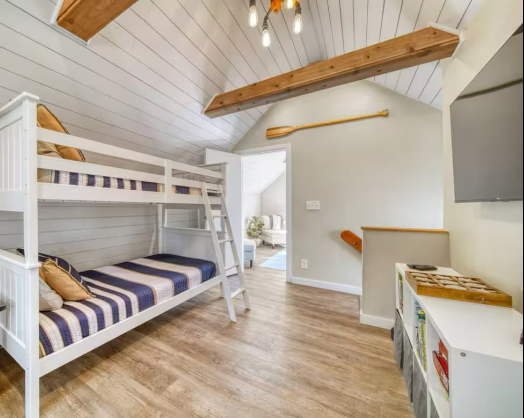 Set sail for adventure in our charming bunk room with nautical inspired twin beds. Immerse yourself in fun with our Disney+ equipped TV.