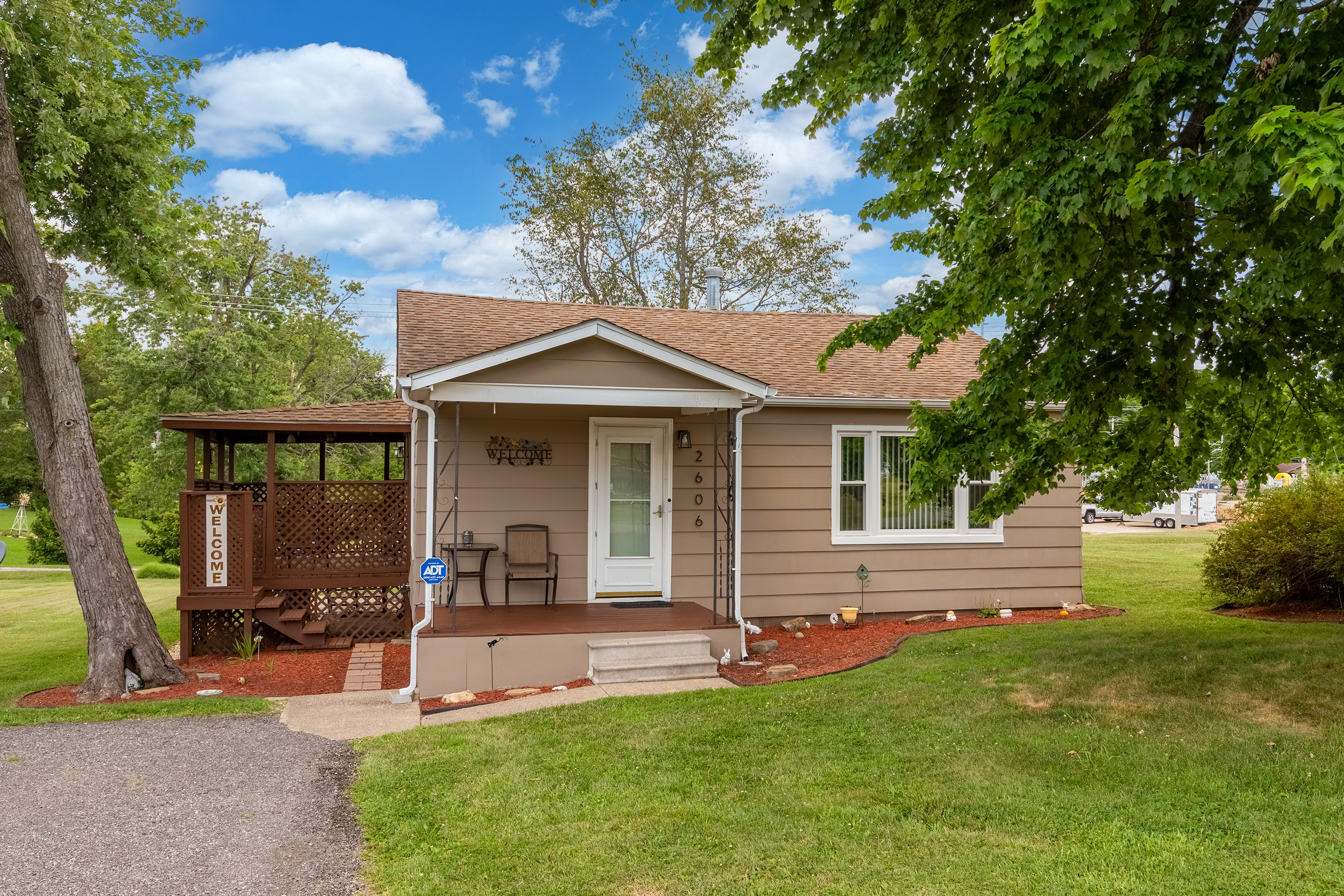 Charming curb appeal. The covered porch adds classic character to this beautifully landscaped home.