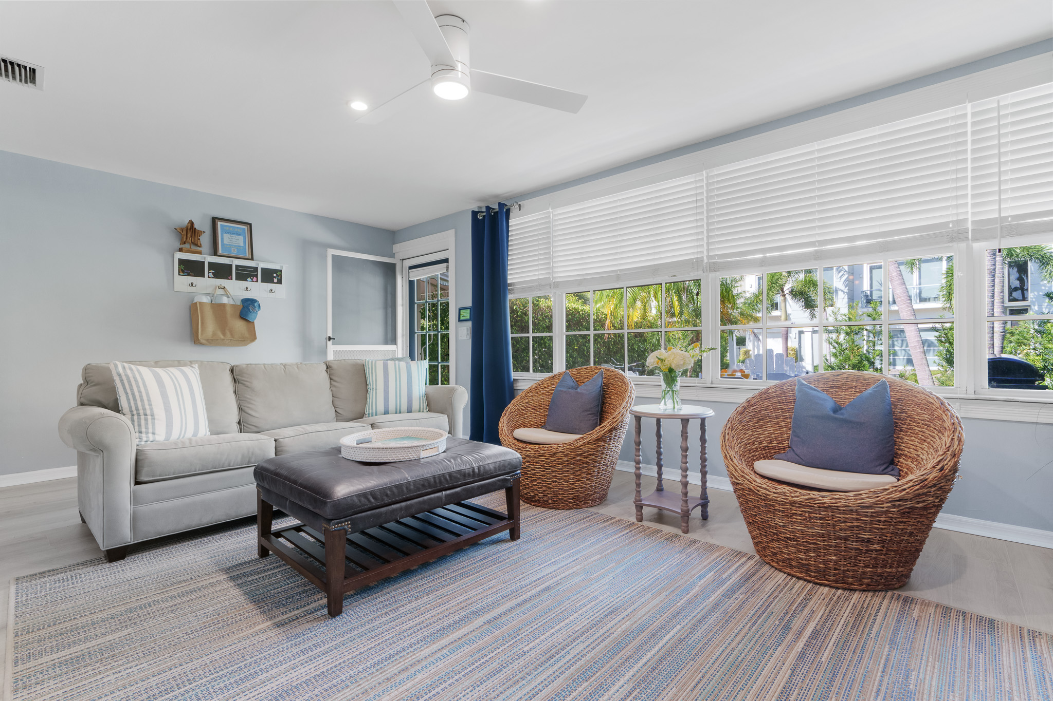 Living space filled with natural light and access to an outdoor patio