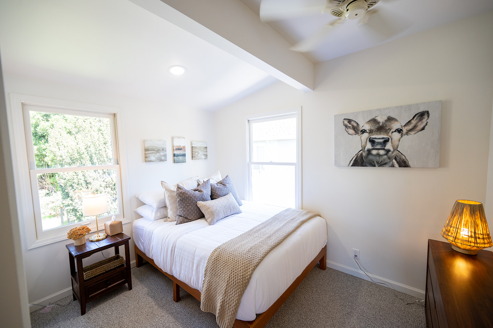 Second bedroom featuring a queen bed with comfortable linens and a quiet, relaxing atmosphere