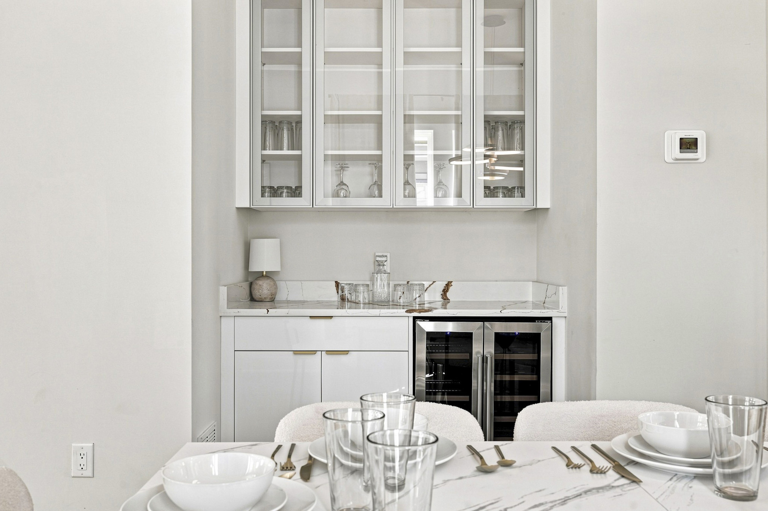 Elegant marble-top bar with chic glassware, perfect for entertaining guests!
