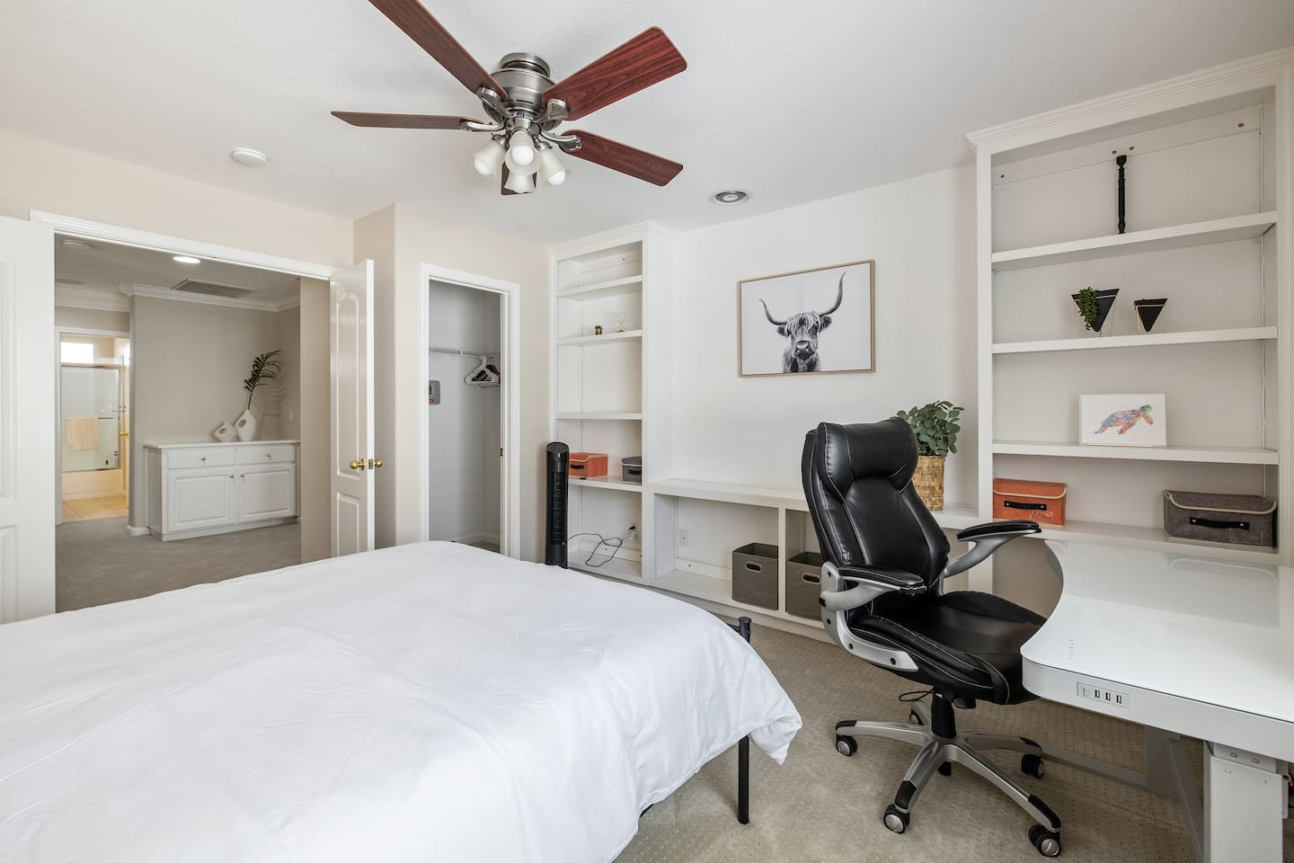 Bedroom 2 with an electrical standing desk and desk chair