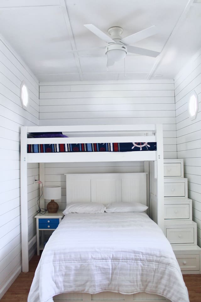 Basement room. Full bed and twin bed. Located off carport, back of house.