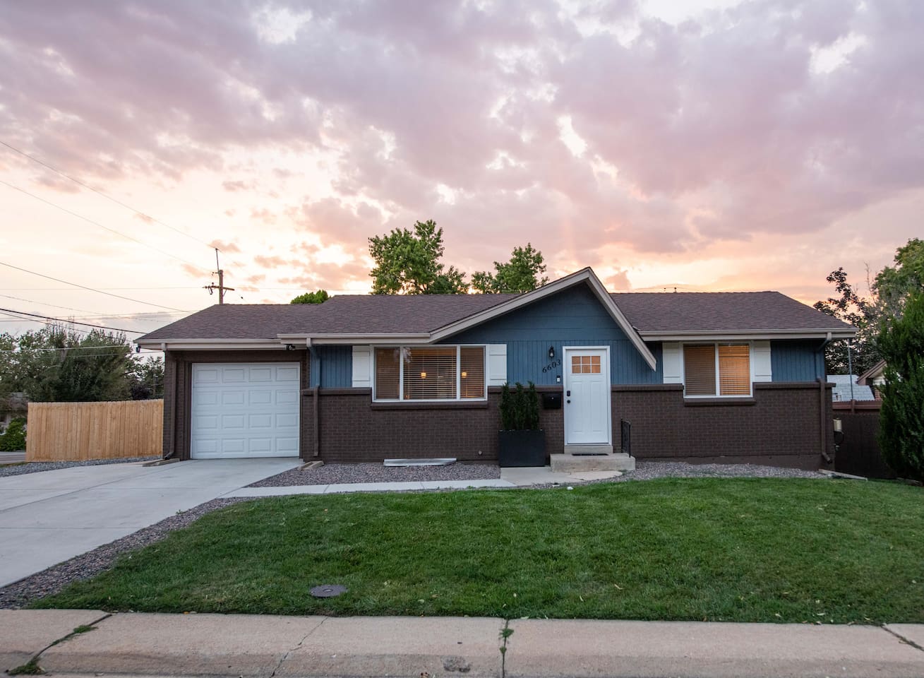 Front of home and main entrance (note garage remains locked for storage and backyard is accessed by walking around the garage to backyard).