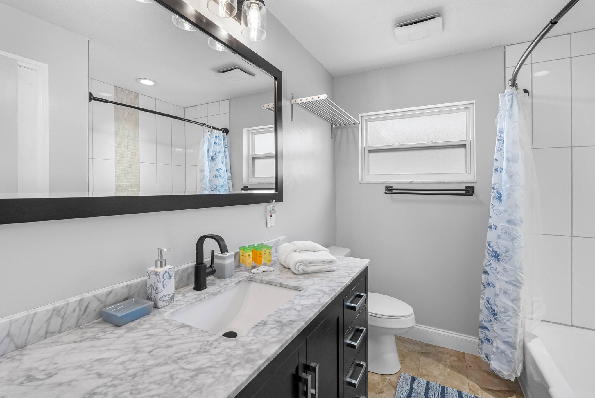 Clean, bright, and comfortable—this full bath offers plenty of counter space, and a peaceful atmosphere.
