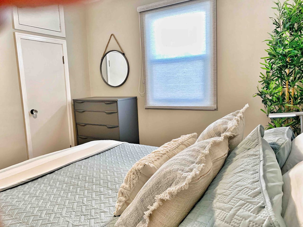 Cozy Second Bedroom with Comfortable Bedding & Warm, Neutral Décor