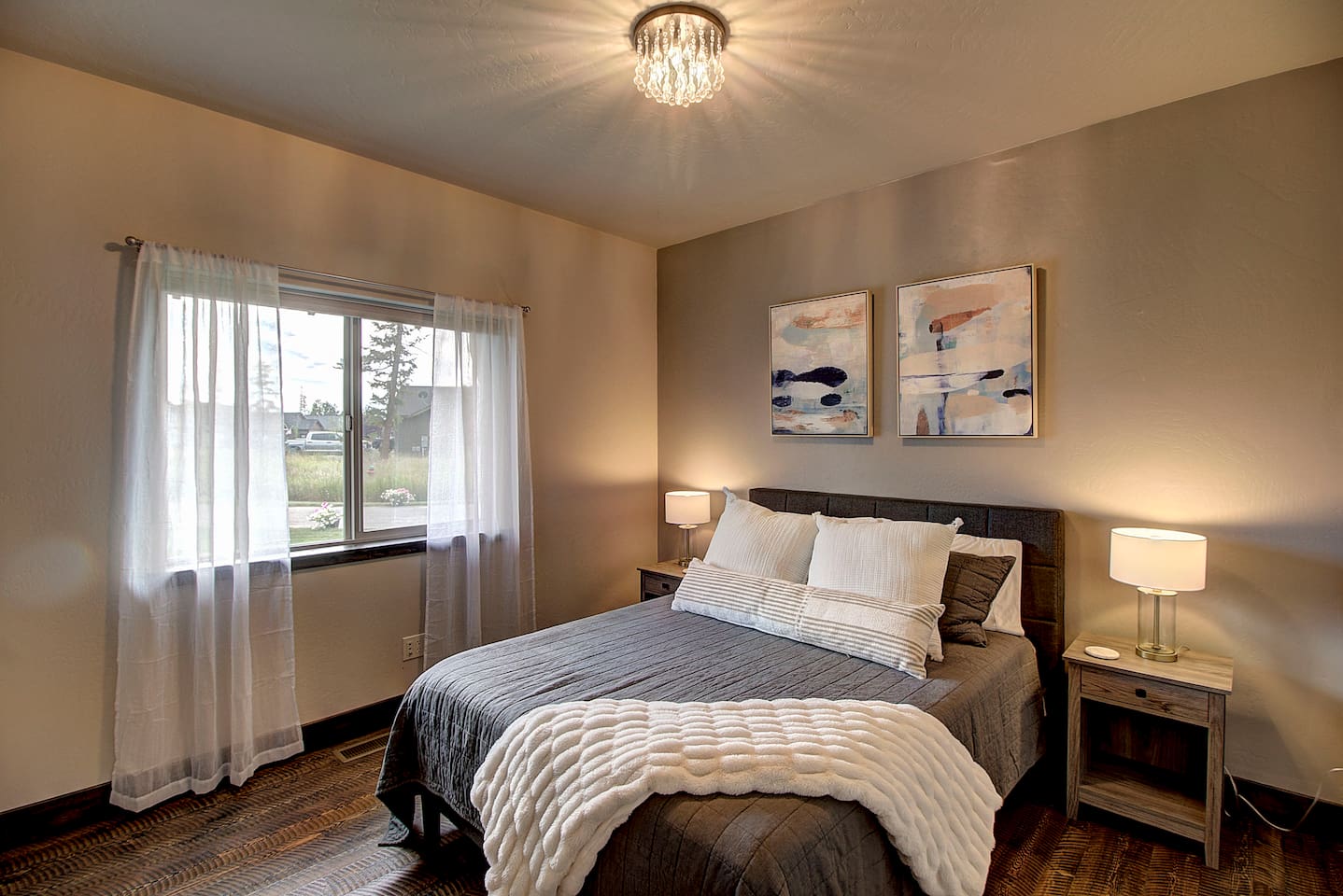 Plush pillows, a chunky knit throw, and gentle lighting make this room easy to love and even harder to leave.