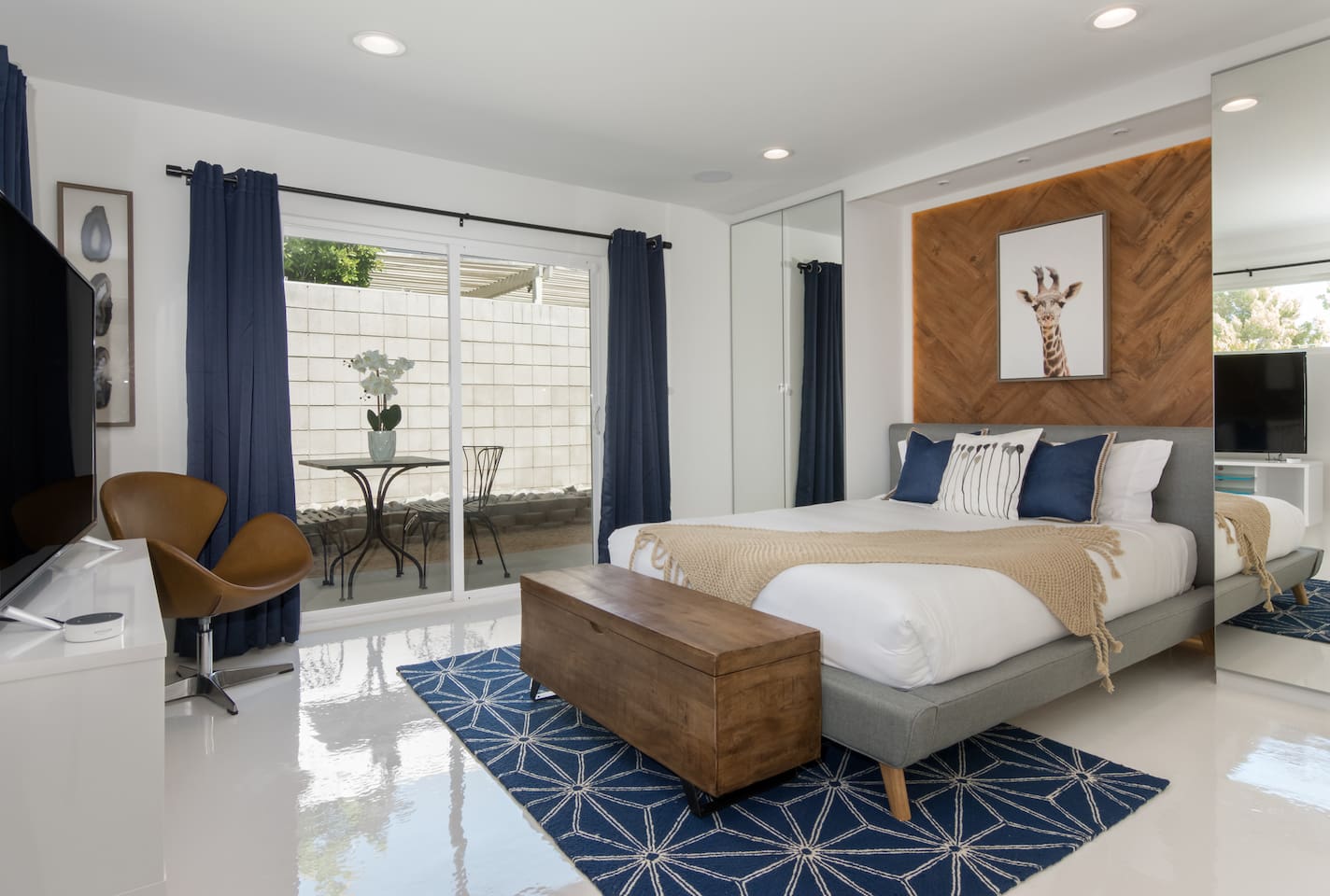 Front bedroom with queen bed and private outdoor patio