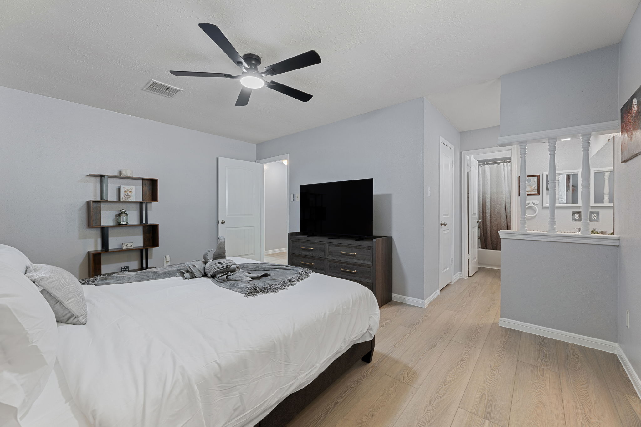 Retreat to the luxurious master suite with a king bed, private bath, and TV for ultimate comfort and privacy.