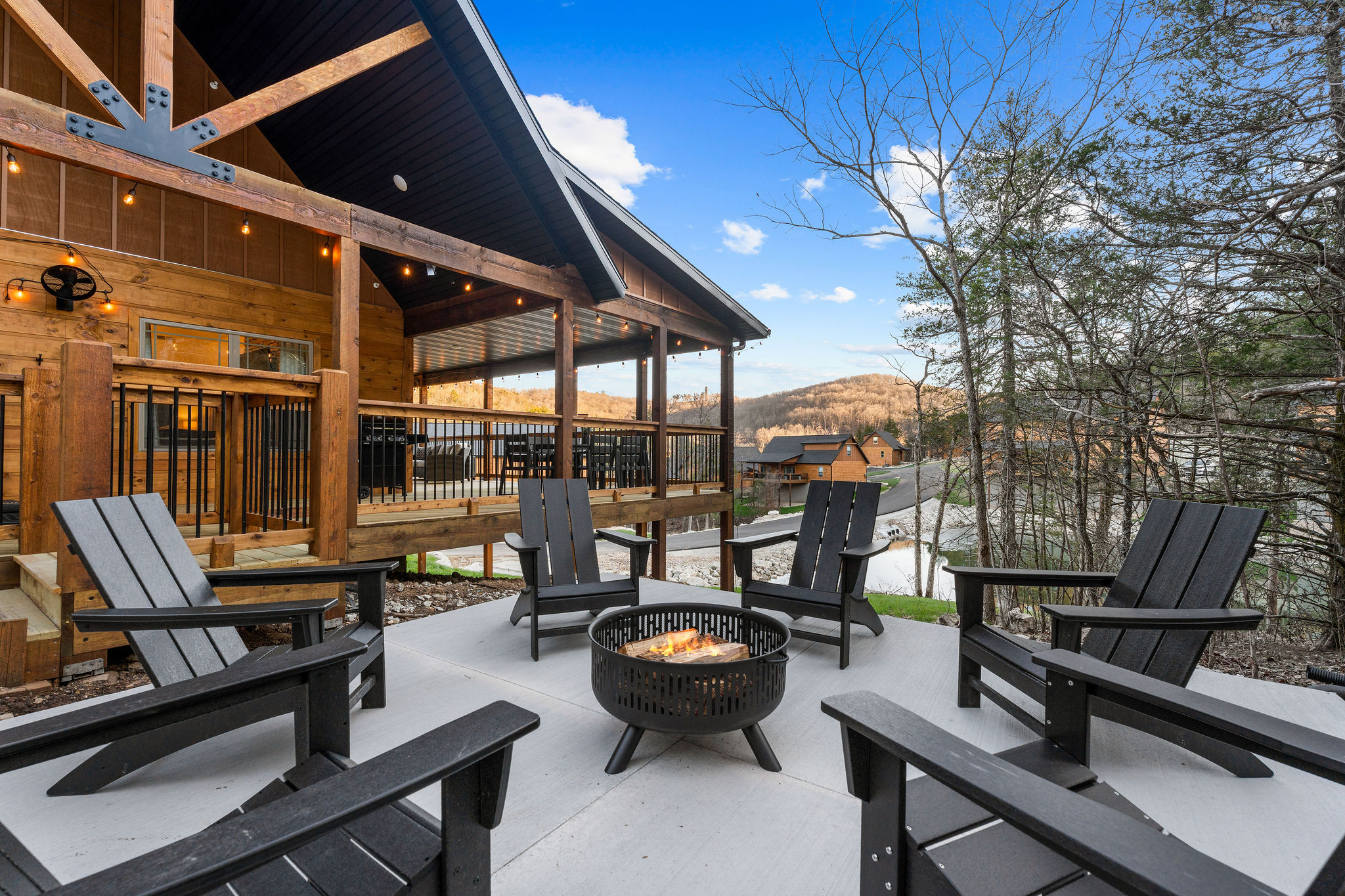 Fire pit seating with a view back toward the cabin.