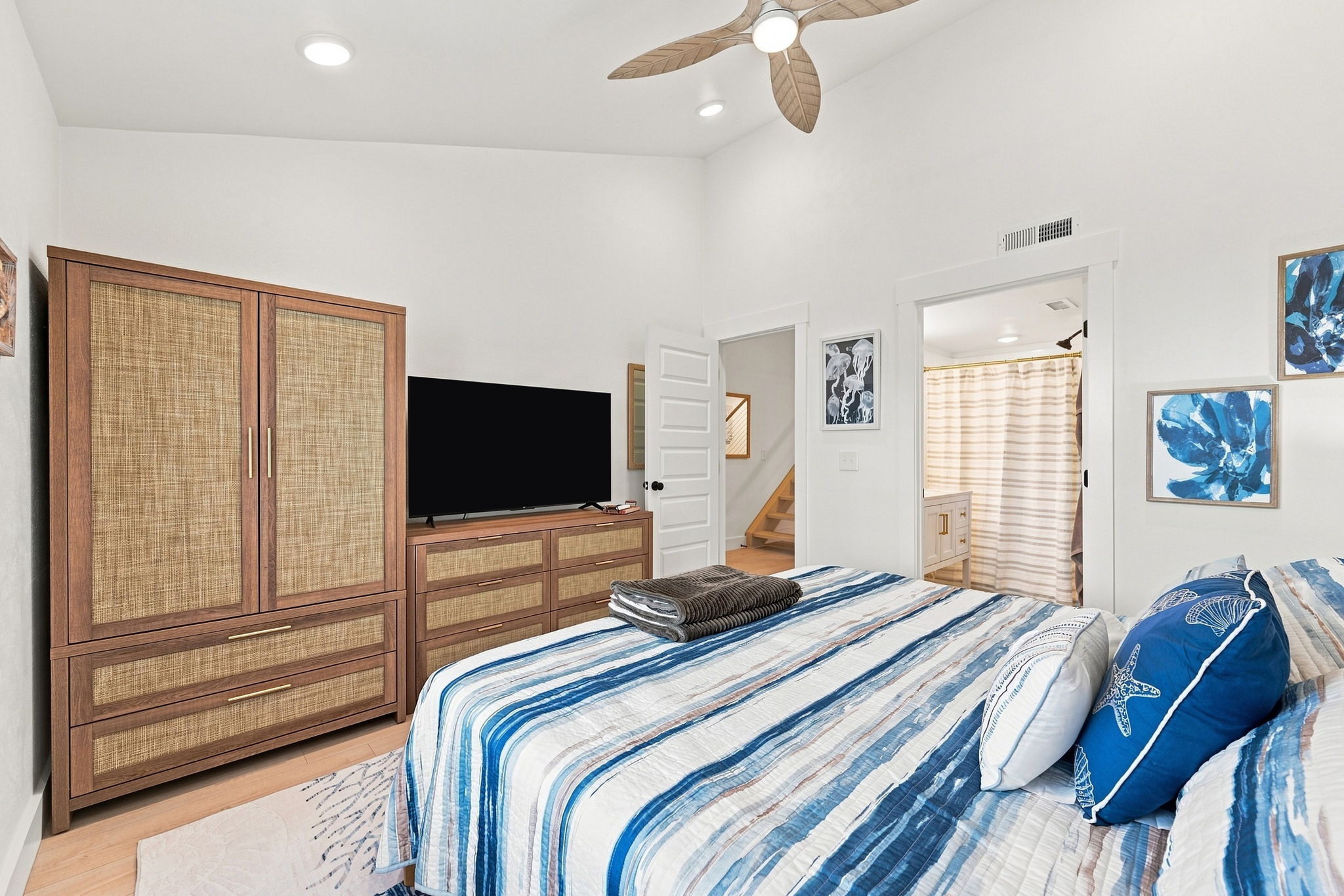 A bedroom designed for easy relaxation, featuring a private ensuite bathroom and Smart TV.
