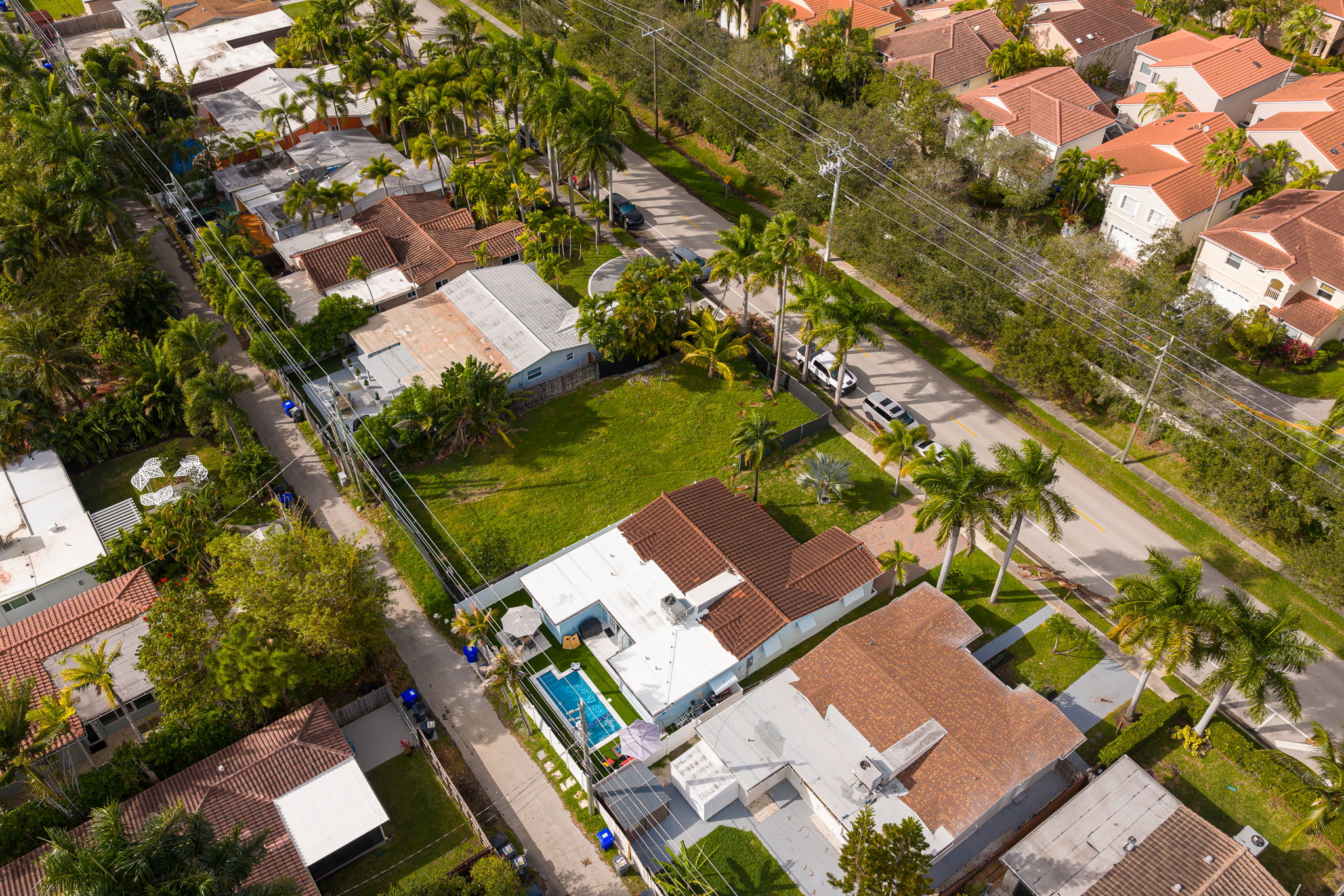 Beautiful 4 bedroom, 3 bathroom pool home in a family-friendly, safe neighborhood. Features a wide paver driveway, tropical palms, and welcoming curb appeal.