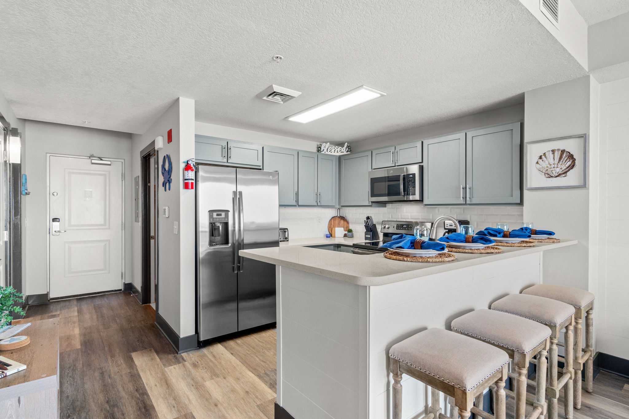 Kitchen seating, more seating in living area and o