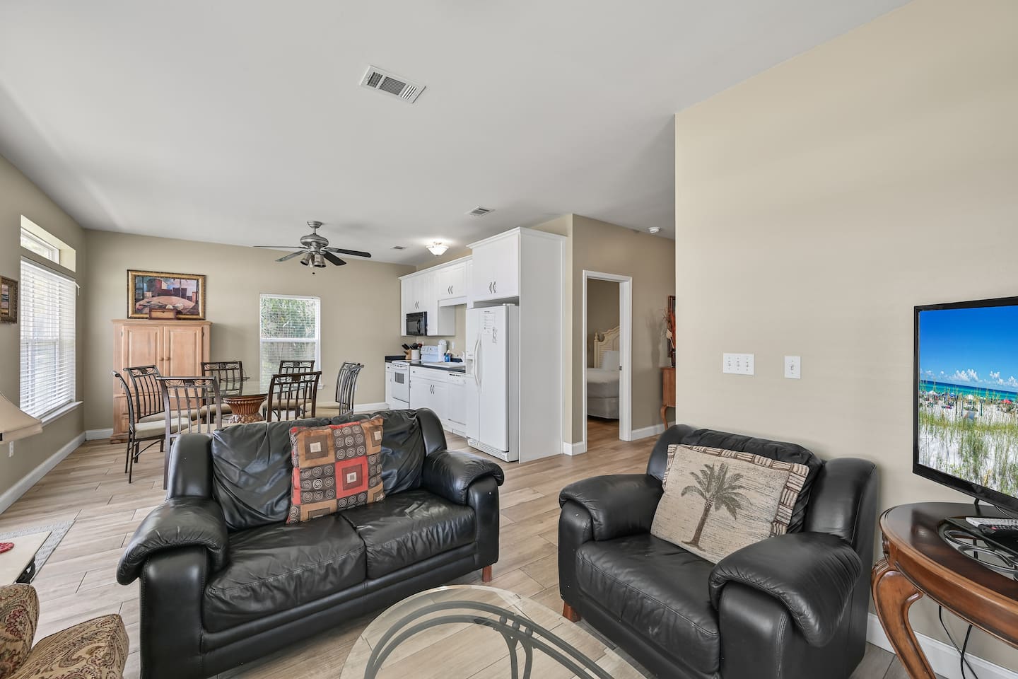 Living Room #1 (First Floor) – Sleeper sofa, loveseat, accent chairs & large TV