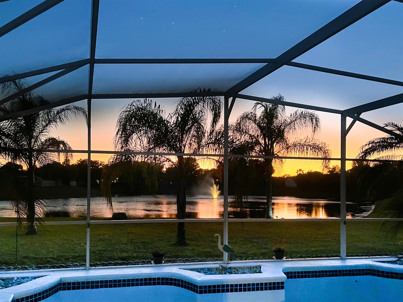 Watch the sun set over the lake from your Private Screened Pool