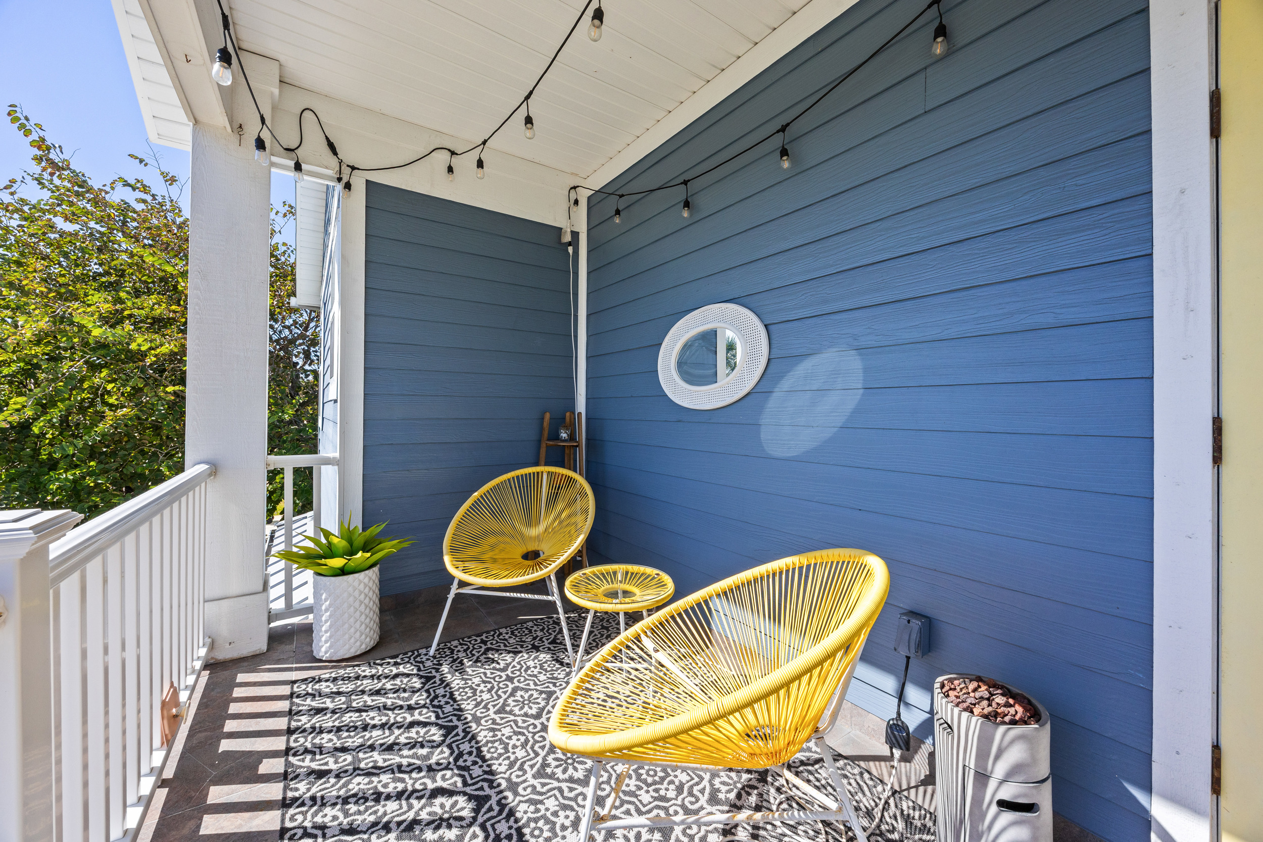 A comfy balcony nook to kick back and enjoy the fresh air.