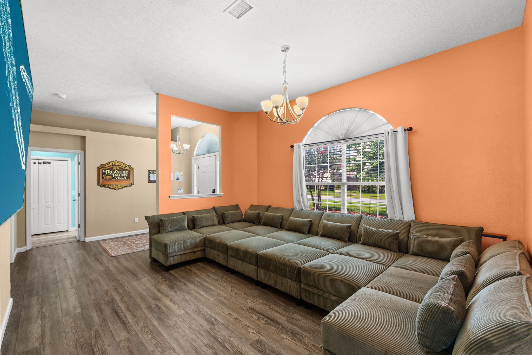 A massive 98‑inch TV anchors the space with immersive entertainment — ideal for movie nights, big games, and streaming your favorite shows in full theater style.
