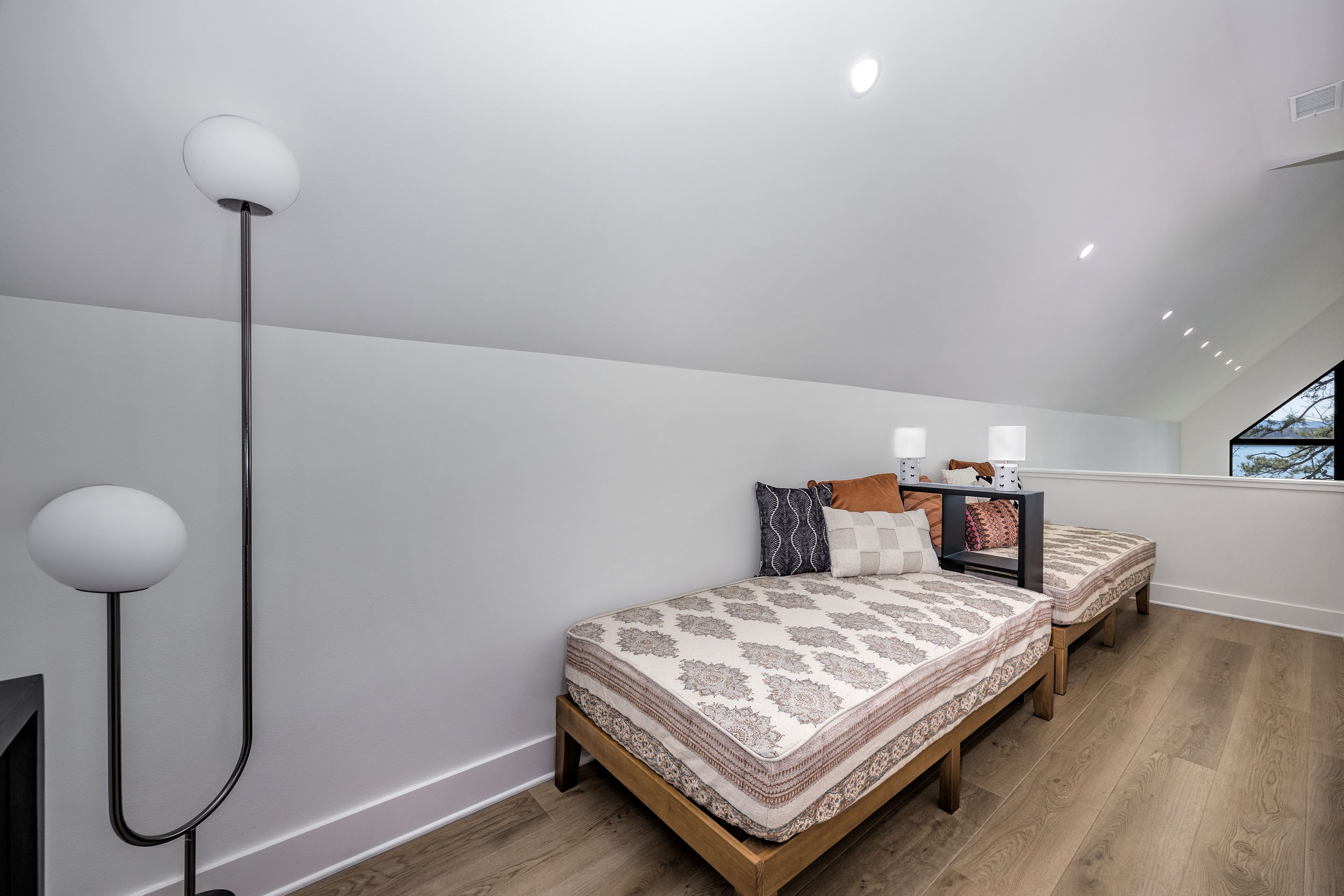 This 2nd upstairs landing features two twin beds—ideal for teens, extra guests, or late-night chats.